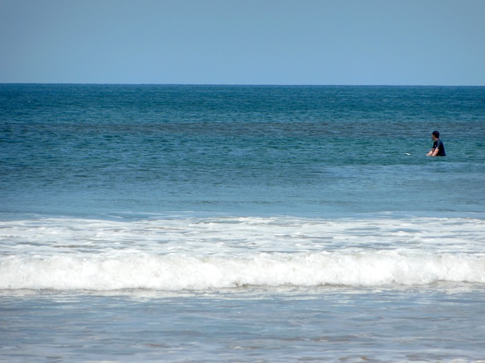 Boyfriend waiting for a wave to surf